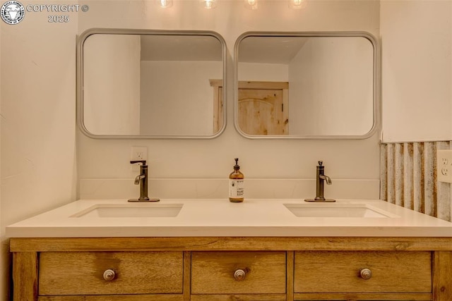 full bath featuring a sink and double vanity