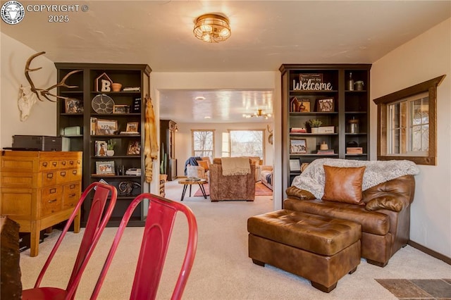 living area featuring light carpet and baseboards