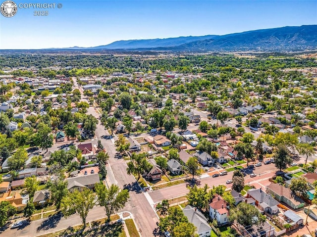 birds eye view of property with a mountain view and a residential view
