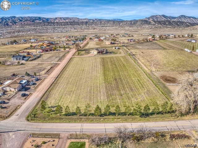 aerial view featuring a rural view and a mountain view