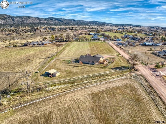 bird's eye view with a mountain view and a rural view