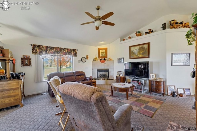 carpeted living room with ceiling fan, a fireplace, and vaulted ceiling