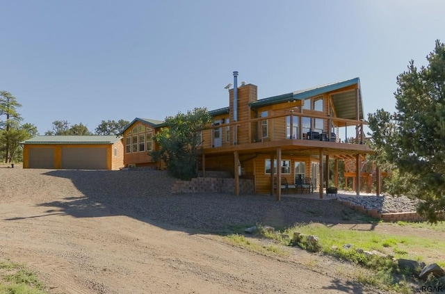 view of front of property featuring a wooden deck and a garage