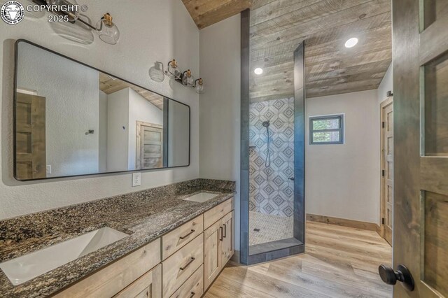 79 Terrazo Abajo, Westcliffe, CO 81252 - full bathroom featuring wood finished floors, double vanity, and a shower stall