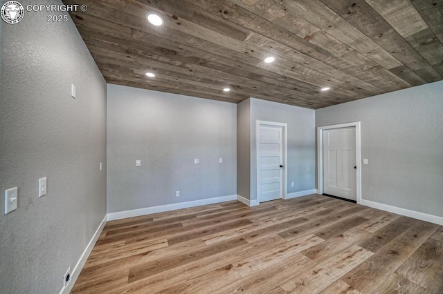 79 Terrazo Abajo, Westcliffe, CO 81252 - below grade area featuring wooden ceiling, wood finished floors, recessed lighting, and a textured wall