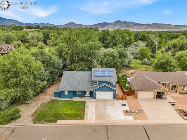 drone / aerial view featuring a mountain view