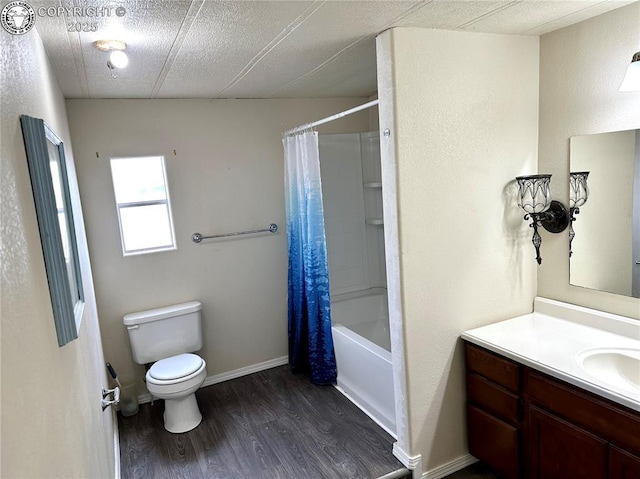 full bath featuring toilet, vanity, wood finished floors, and shower / bath combo with shower curtain