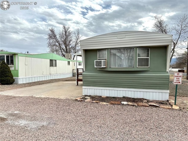 view of side of property featuring cooling unit