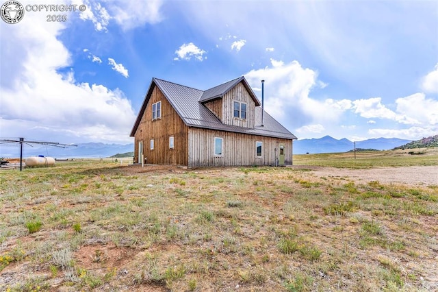 3491 County Road 215th Rd, Westcliffe, CO 81252 - view of side of home with a metal roof and a mountain view