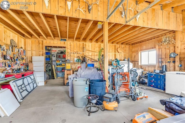 3491 County Road 215th Rd, Westcliffe, CO 81252 - garage featuring fridge and a workshop area