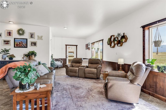 3491 County Road 215th Rd, Westcliffe, CO 81252 - living area with plenty of natural light, a wainscoted wall, and wooden walls