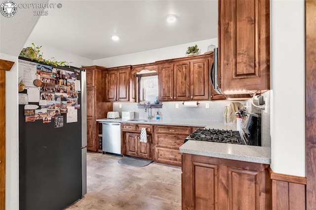 3491 County Road 215th Rd, Westcliffe, CO 81252 - kitchen featuring appliances with stainless steel finishes, light flooring, light countertops, and brown cabinets