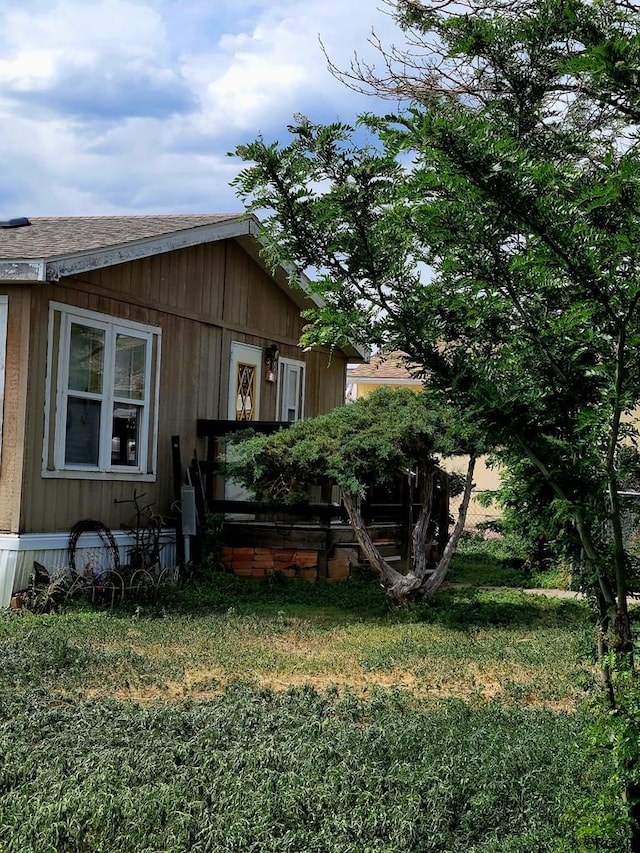 view of home's exterior featuring a yard