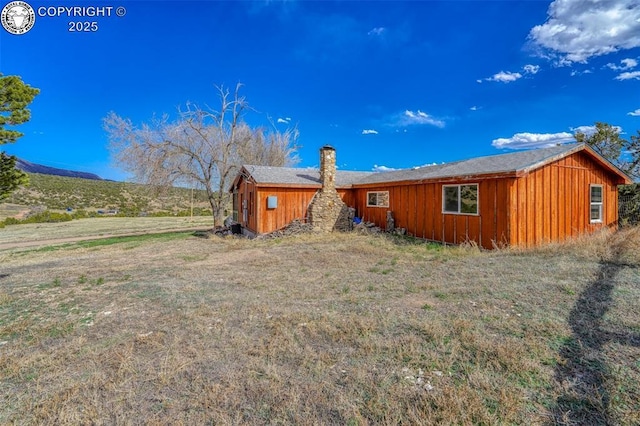 321 County Road 353a, Canon City, CO 81212 - rear view of house featuring a chimney