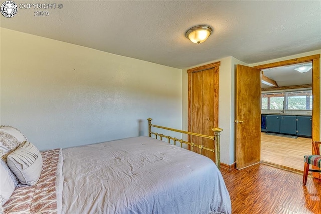 321 County Road 353a, Canon City, CO 81212 - bedroom with wood finished floors and a textured ceiling