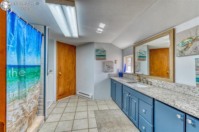 321 County Road 353a, Canon City, CO 81212 - bathroom featuring a baseboard radiator, vanity, a textured ceiling, lofted ceiling, and tile patterned floors