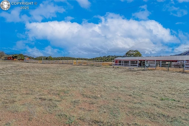 321 County Road 353a, Canon City, CO 81212 - view of yard with an outdoor riding arena, a rural view, an exterior structure, and an outbuilding
