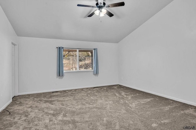 carpeted empty room featuring ceiling fan and lofted ceiling