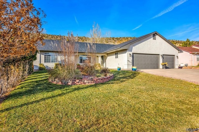 ranch-style house featuring a garage and a front yard