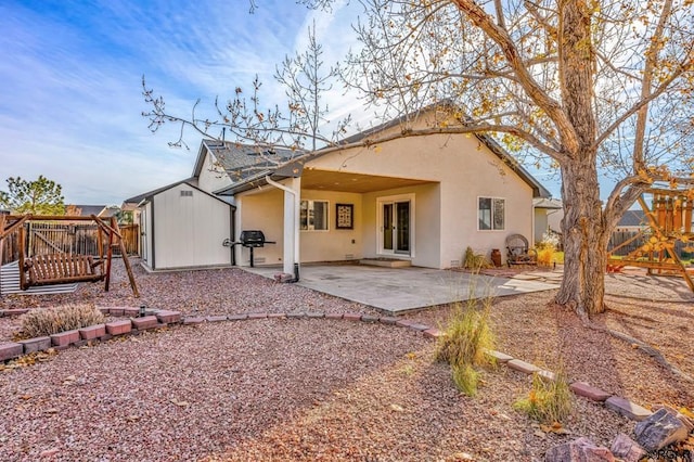 back of house featuring a patio