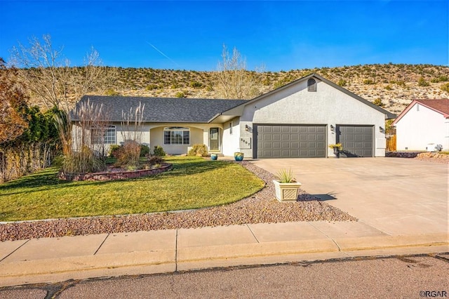 ranch-style house with a garage and a front yard