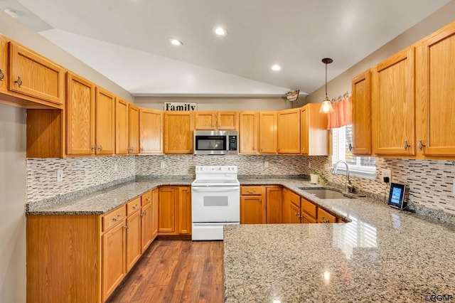 kitchen with pendant lighting, sink, white electric range oven, dark hardwood / wood-style flooring, and vaulted ceiling