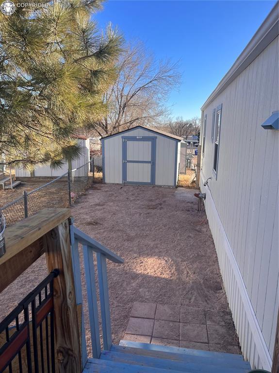 view of yard with a shed