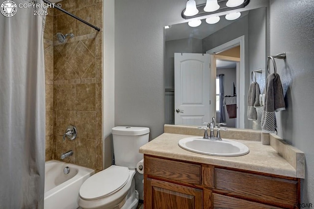 bathroom with toilet, shower / bath combo with shower curtain, and vanity