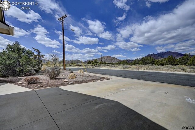 view of patio / terrace with a mountain view