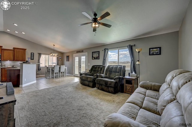 living room featuring lofted ceiling, light tile patterned floors, french doors, and light carpet