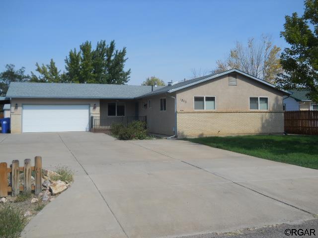 ranch-style home with a garage