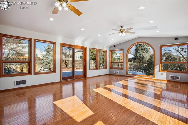 interior space featuring ceiling fan, lofted ceiling, and light hardwood / wood-style flooring