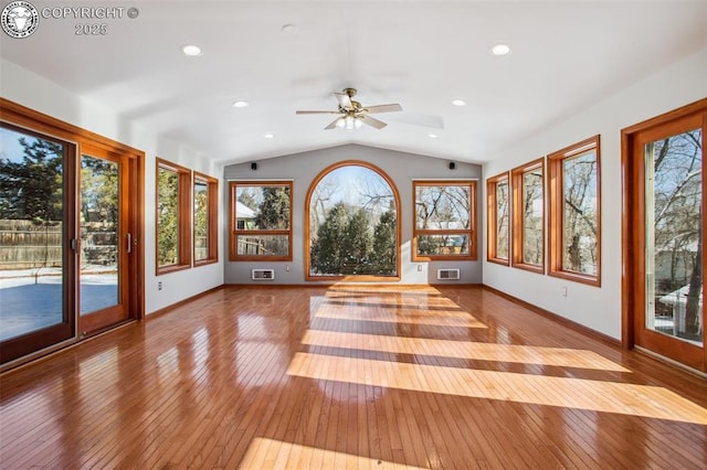 unfurnished sunroom with lofted ceiling and ceiling fan