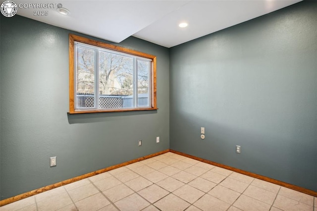 empty room featuring light tile patterned floors