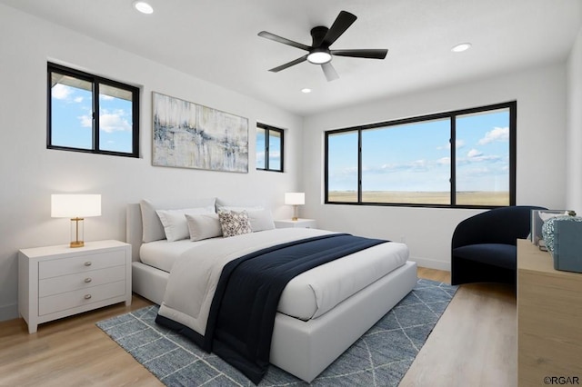 bedroom featuring wood-type flooring and ceiling fan