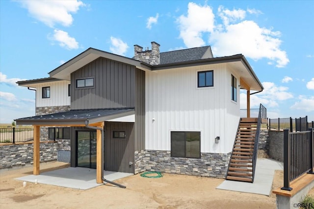 back of property featuring a patio