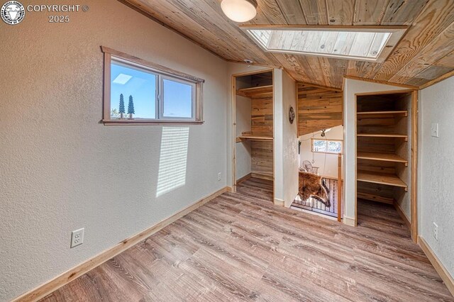 820 Little Horn Dr, Westcliffe, CO 81252 - interior space featuring a textured wall, wood ceiling, and wood finished floors