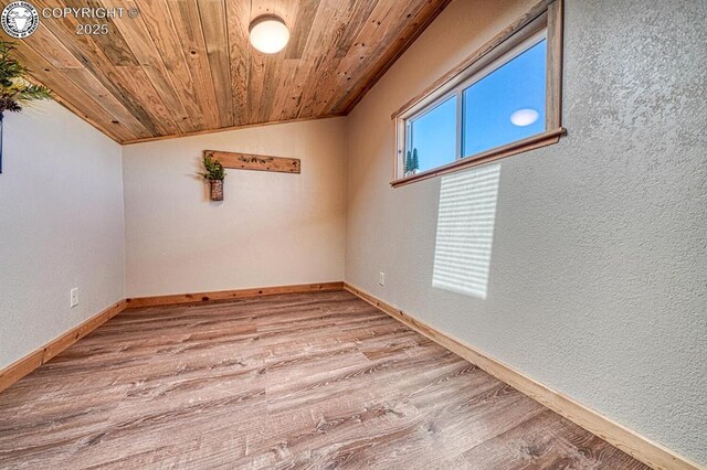 820 Little Horn Dr, Westcliffe, CO 81252 - empty room with wood ceiling, baseboards, vaulted ceiling, and wood finished floors