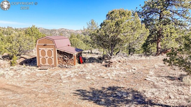 820 Little Horn Dr, Westcliffe, CO 81252 - exterior space with a storage unit and an outbuilding