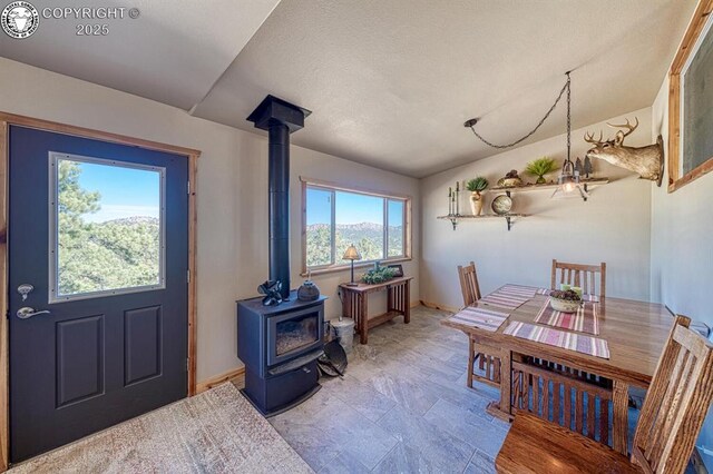 820 Little Horn Dr, Westcliffe, CO 81252 - dining room with baseboards and a wood stove