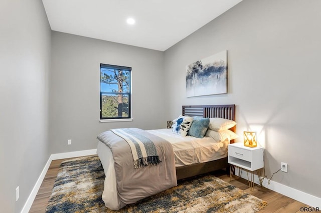 bedroom featuring hardwood / wood-style floors