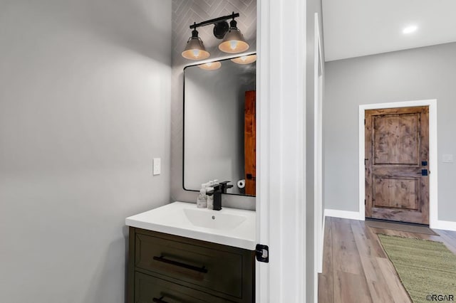 bathroom featuring vanity and wood-type flooring