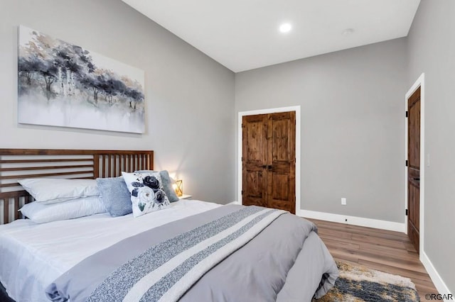 bedroom with wood-type flooring