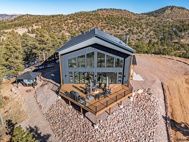 back of house featuring a mountain view