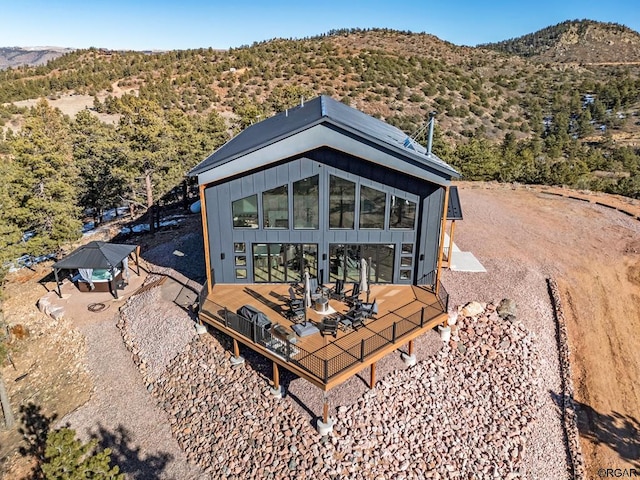 rear view of property with a mountain view