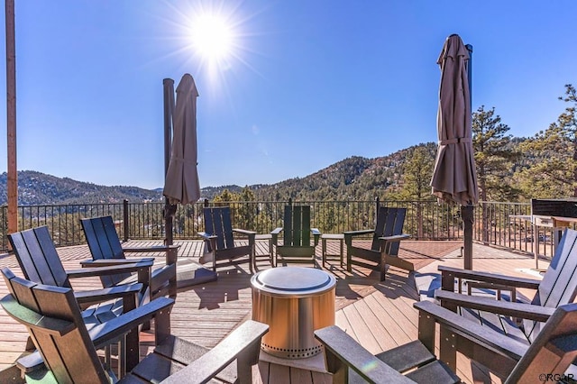 wooden deck featuring a mountain view