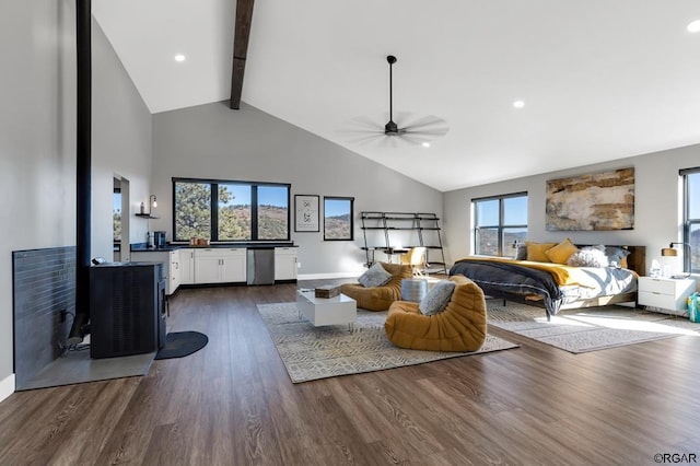 bedroom featuring multiple windows, beam ceiling, dark hardwood / wood-style floors, and ceiling fan