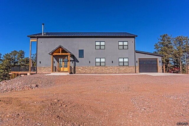 view of front of house with french doors and a garage