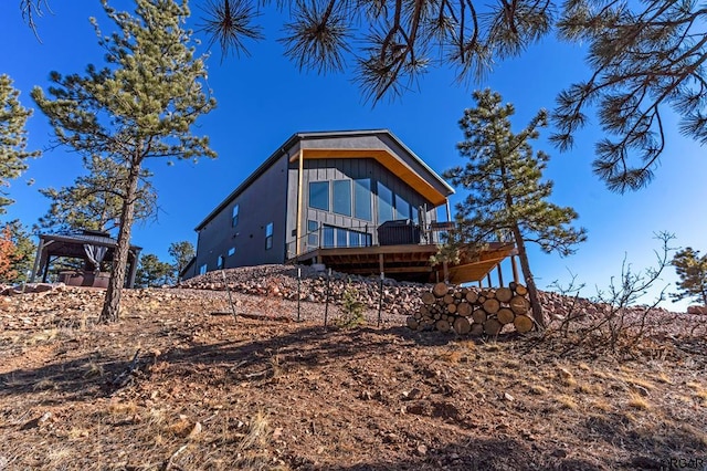 view of side of property featuring a deck