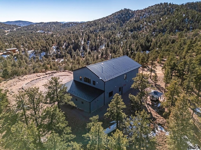 birds eye view of property with a mountain view